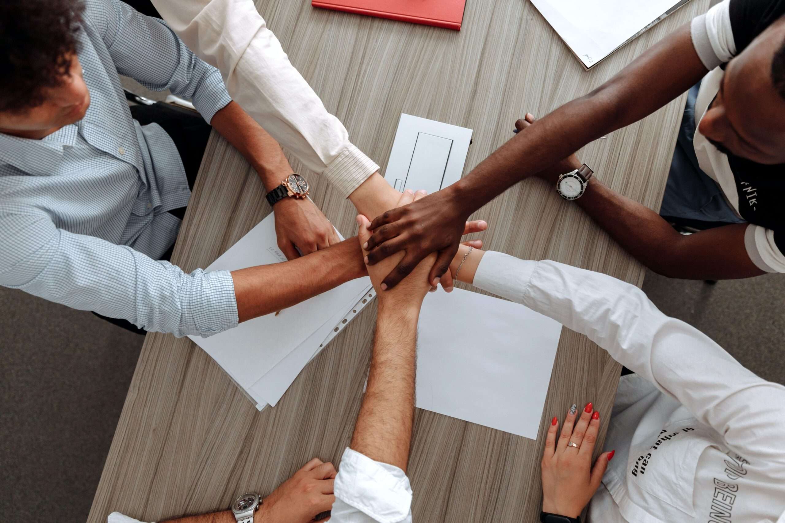 group of people shaking hands